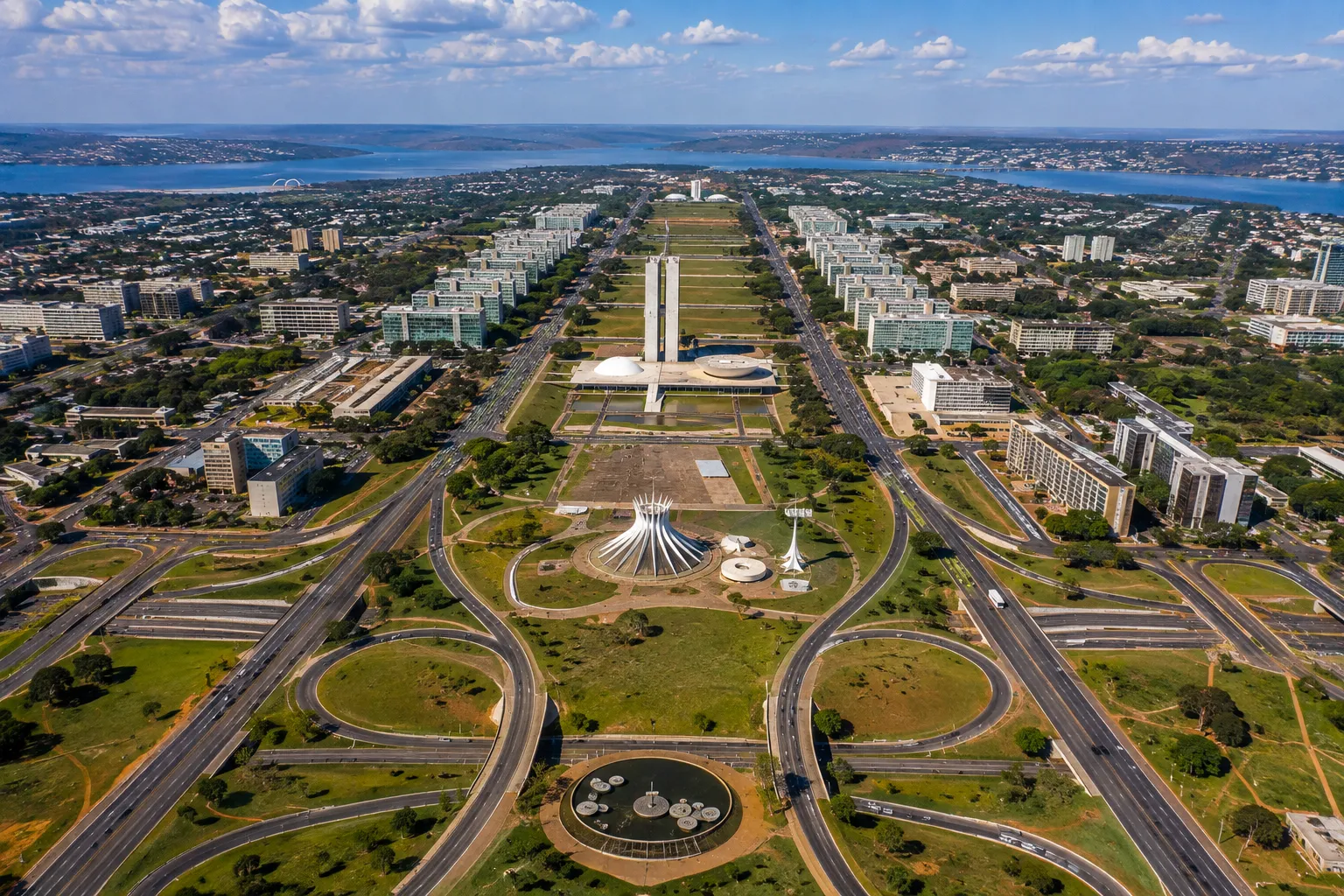 An aerial view reveals Brasília’s unique design, with wide avenues, modern buildings, and expansive green spaces