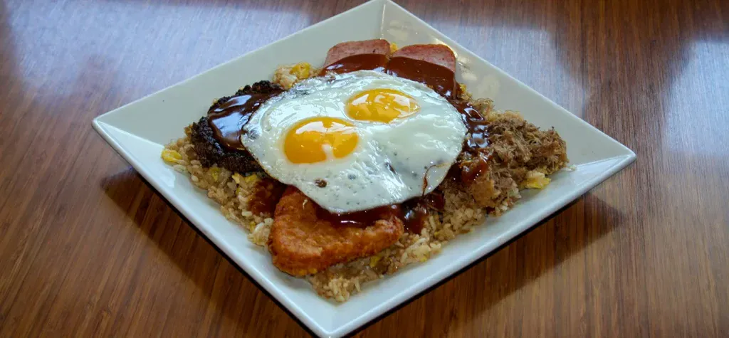 The famous Loco Moco (rice topped with a burger patty, egg, and gravy)