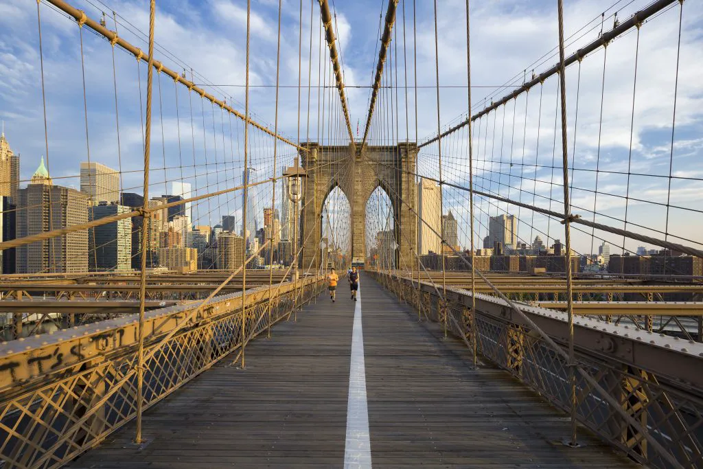 Crossing the Brooklyn Bridge at Dawn