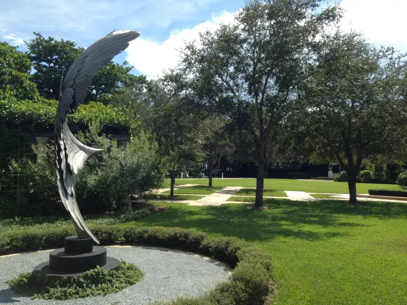 Tropical gardens surround a cultural institution dedicated to art, literature, education, and peaceful outdoor spaces